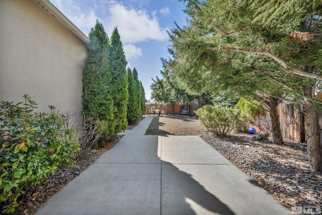 view of yard featuring a patio and fence