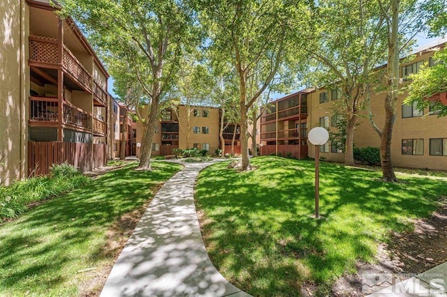 view of property's community featuring a yard