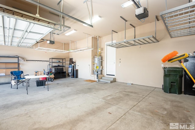 garage featuring secured water heater and a garage door opener