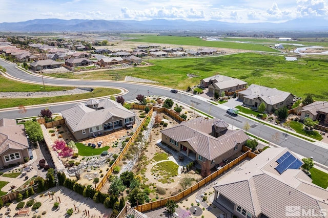 drone / aerial view with a residential view and a mountain view