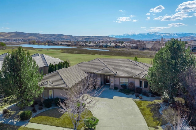 aerial view featuring a water and mountain view