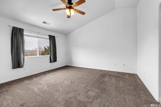 carpeted empty room featuring visible vents, baseboards, a ceiling fan, and vaulted ceiling