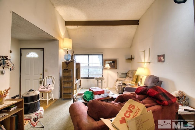 living area featuring lofted ceiling with beams and a textured ceiling