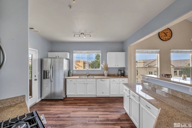 kitchen with white cabinetry, stainless steel fridge with ice dispenser, a sink, dark wood-type flooring, and dishwasher