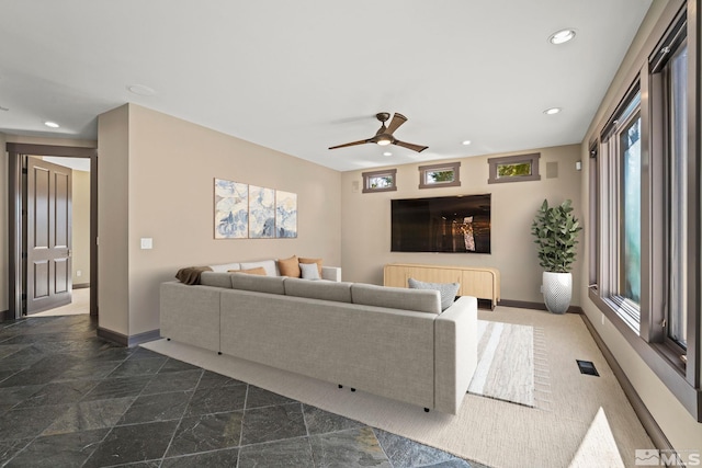 living room with a ceiling fan, recessed lighting, visible vents, and baseboards