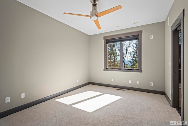 unfurnished bedroom with visible vents, baseboards, carpet, and a ceiling fan