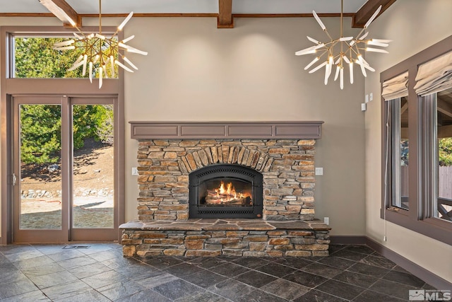 room details with baseboards, a notable chandelier, and a fireplace