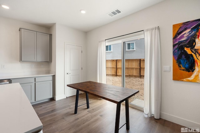 office space featuring visible vents, recessed lighting, baseboards, and dark wood-style flooring