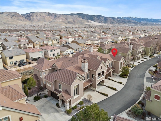 aerial view with a mountain view and a residential view