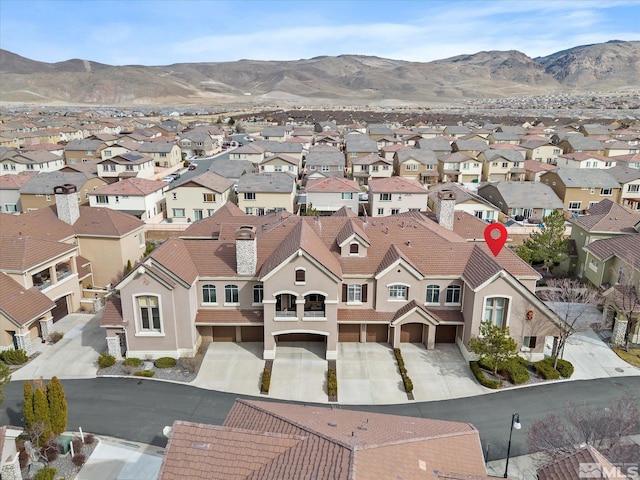 aerial view featuring a mountain view and a residential view