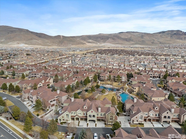 birds eye view of property featuring a mountain view and a residential view