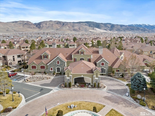 aerial view featuring a mountain view and a residential view