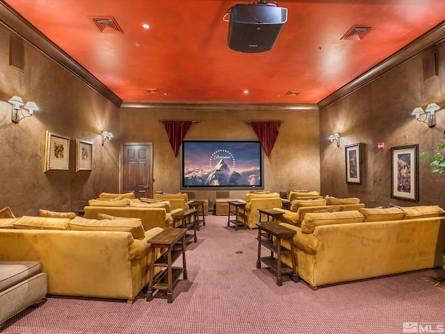 carpeted home theater featuring visible vents and crown molding