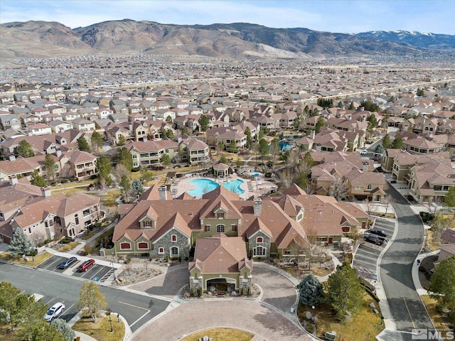 birds eye view of property with a mountain view and a residential view