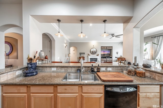 kitchen featuring open floor plan, black dishwasher, ornamental molding, a ceiling fan, and a sink