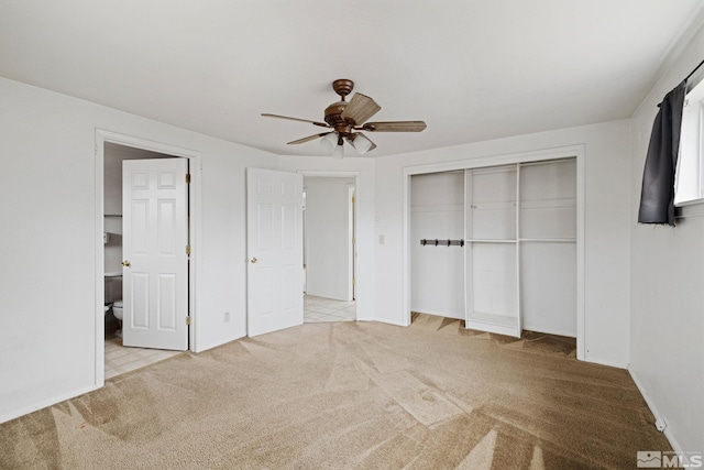 unfurnished bedroom with a closet, carpet, and a ceiling fan