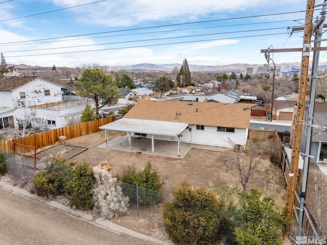 birds eye view of property featuring a mountain view and a residential view