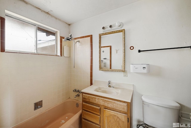 bathroom with vanity, shower / bathing tub combination, and toilet