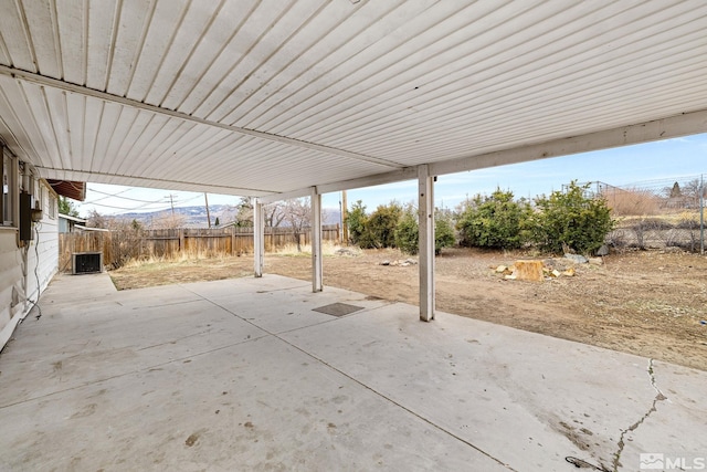 view of patio / terrace with central AC unit and fence