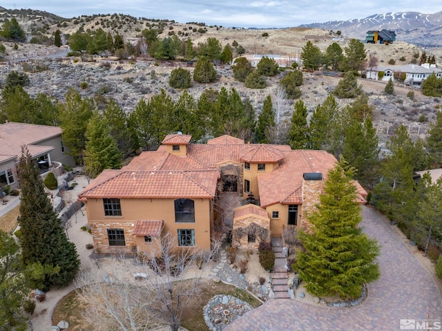 birds eye view of property featuring a mountain view