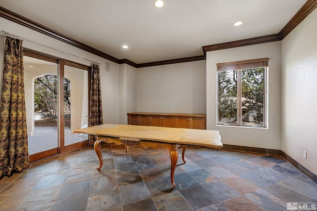 unfurnished dining area with crown molding, recessed lighting, baseboards, and stone tile flooring