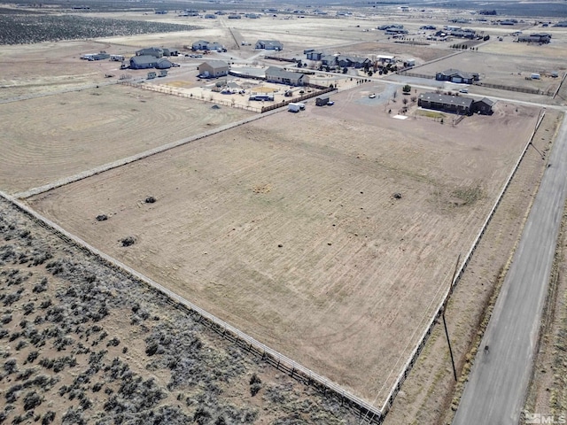 birds eye view of property featuring a rural view