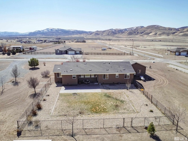 birds eye view of property featuring a mountain view