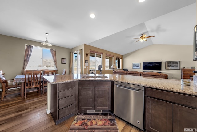 kitchen featuring a sink, light stone countertops, stainless steel dishwasher, and dark brown cabinets