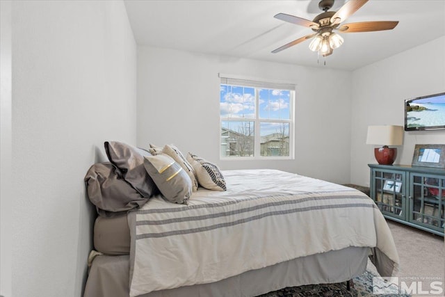 carpeted bedroom featuring a ceiling fan