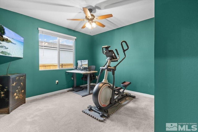 workout area featuring carpet, baseboards, and ceiling fan