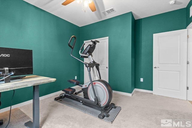 exercise room featuring visible vents, baseboards, ceiling fan, and carpet flooring