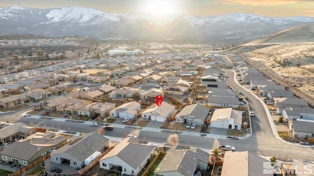 drone / aerial view featuring a residential view and a mountain view