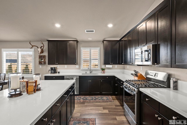 kitchen with visible vents, light countertops, recessed lighting, stainless steel appliances, and a sink