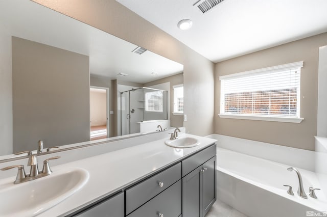 full bath featuring a sink, visible vents, a garden tub, and a shower stall