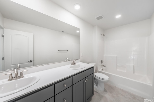 full bath featuring a sink, visible vents, toilet, and double vanity