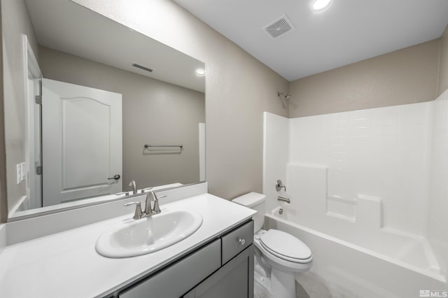 bathroom featuring visible vents, toilet, shower / bath combination, and vanity