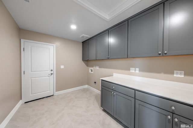 laundry area featuring washer hookup, cabinet space, baseboards, and electric dryer hookup