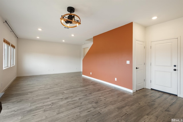 interior space with visible vents, recessed lighting, baseboards, and wood finished floors