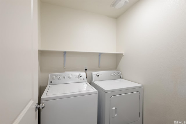 clothes washing area with laundry area and independent washer and dryer