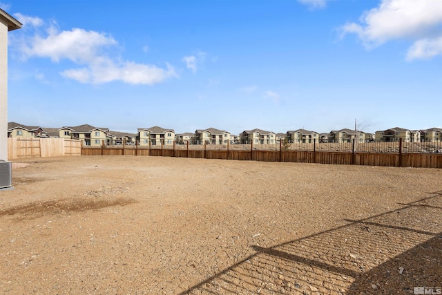 view of yard with fence and a residential view