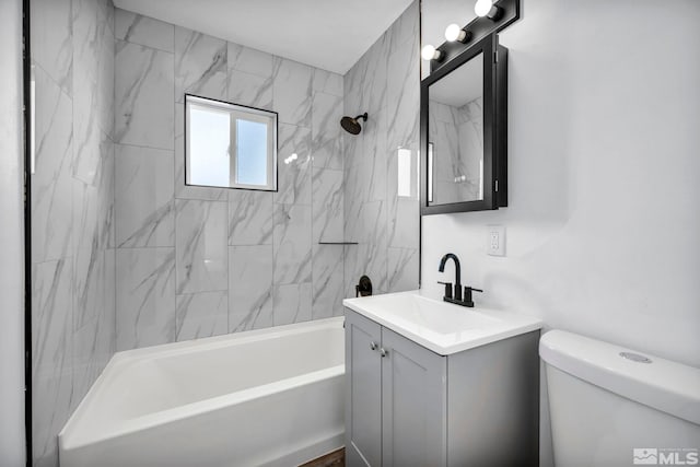 bathroom with vanity, toilet, and tub / shower combination