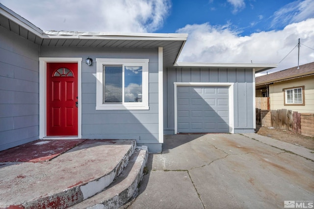 exterior space with driveway and an attached garage