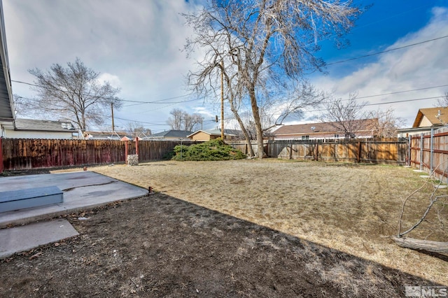 view of yard featuring a patio and a fenced backyard