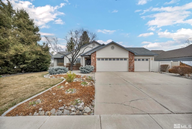 ranch-style home featuring an attached garage, driveway, a front lawn, and fence