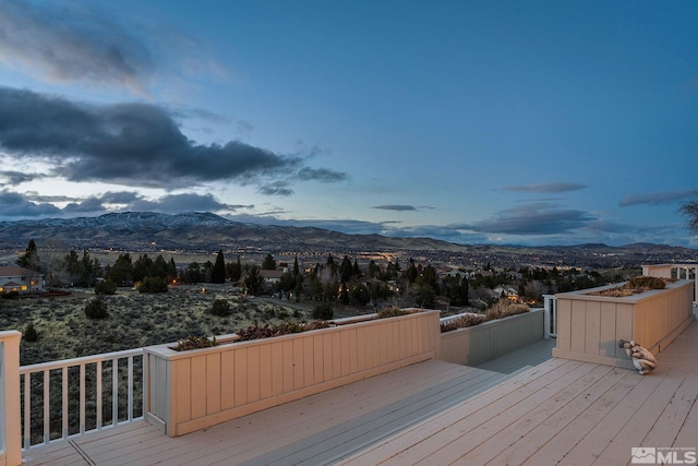 wooden terrace featuring a mountain view