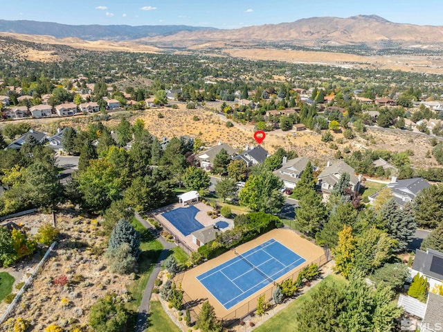 birds eye view of property with a mountain view and a residential view