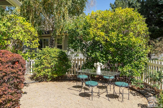 view of patio featuring fence