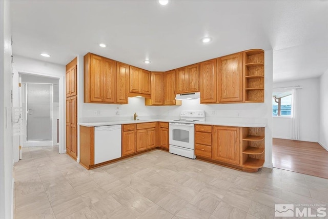 kitchen featuring white appliances, light countertops, open shelves, and under cabinet range hood