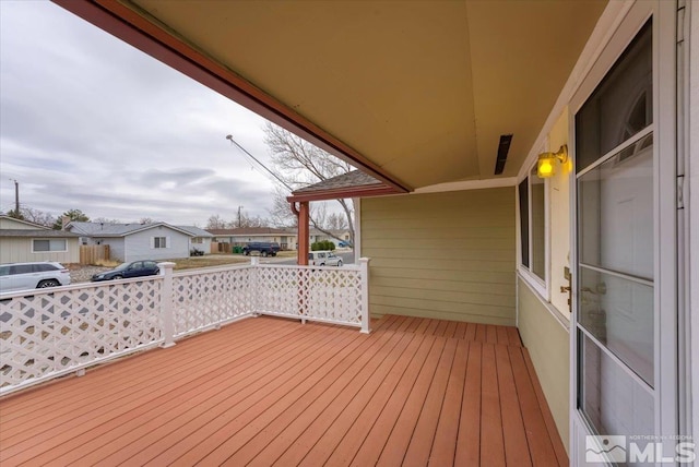 wooden deck with a residential view