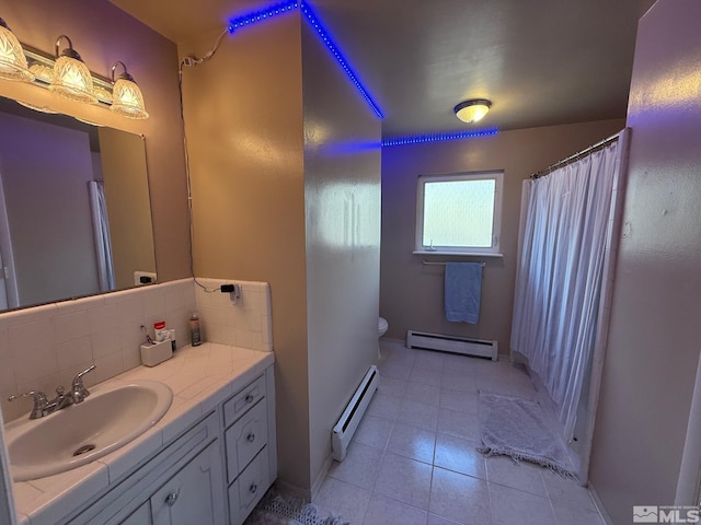 full bath with decorative backsplash, toilet, vanity, and a baseboard radiator